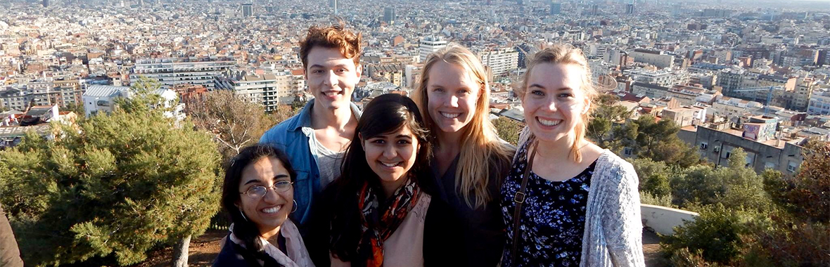 Group of people taking a photo over a city scape