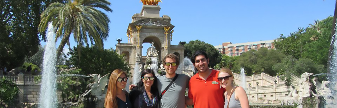 People standing in front of a fountain