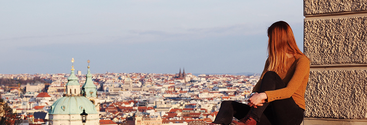 Person staring out at a city